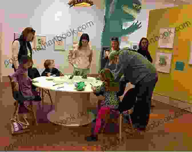 A Group Of Children And Educators Gathered Around A Table At The Eric Carle Museum, Engaged In An Interactive Art Activity. Collage Workshop For Kids: Rip Snip Cut And Create With Inspiration From The Eric Carle Museum