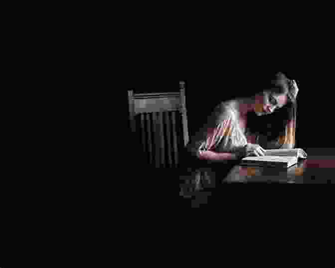 A Young Woman Reading A Book In A Dark Room Reading Lolita In Tehran: A Memoir In